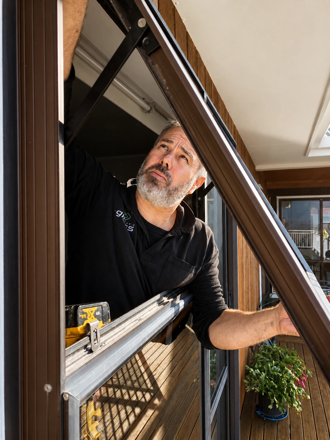 Glasseast glazier repairing a residential window